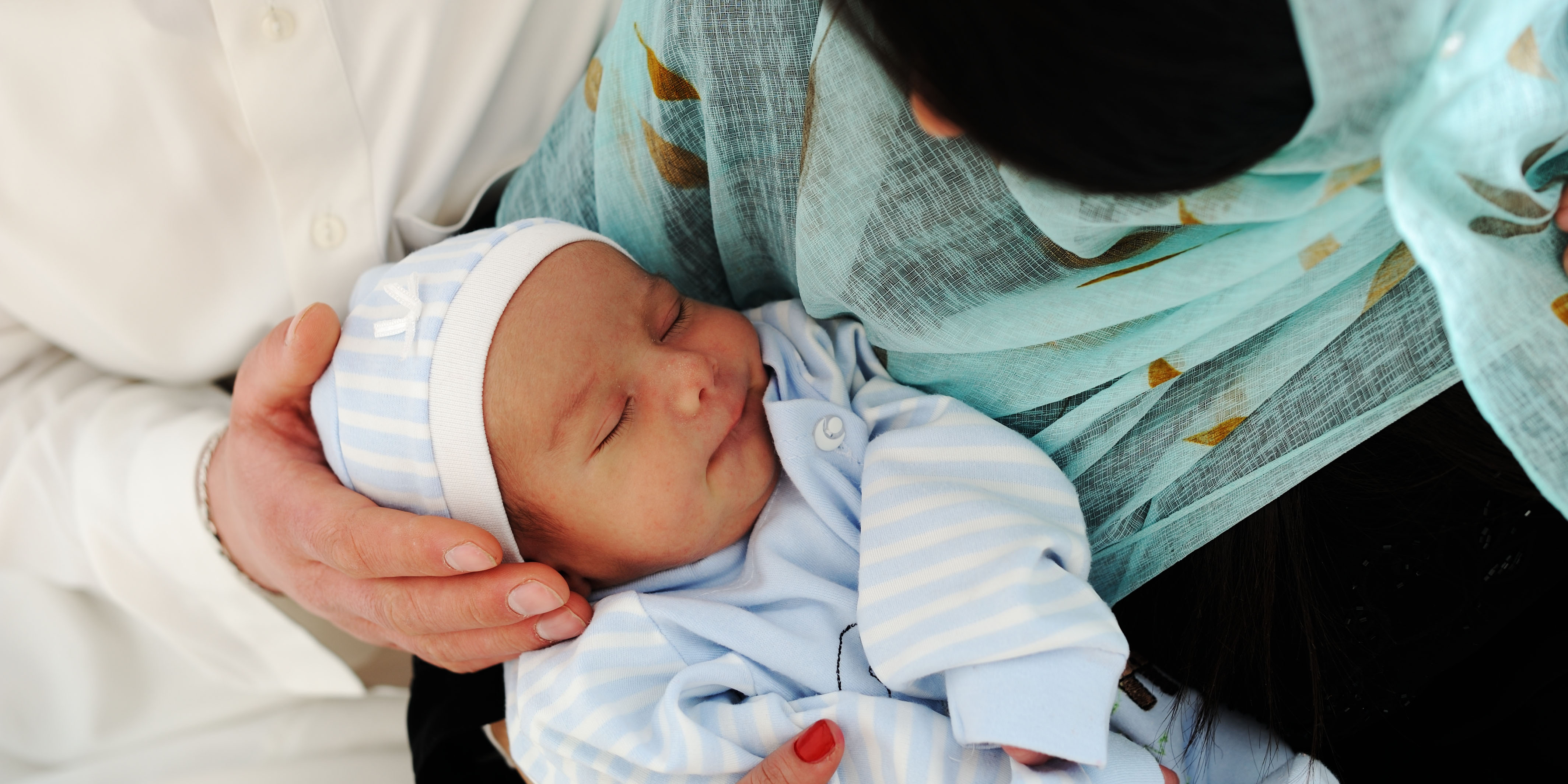 mother and father with newborn